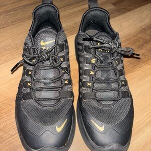 Nike Black Sneakers with Gold Highlights